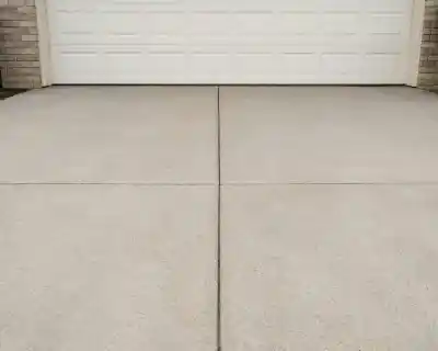 Concrete driveway in front of white building | Charleston Concrete