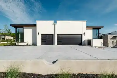 Concrete driveways outside two contemporary white homes | Charleston Concrete