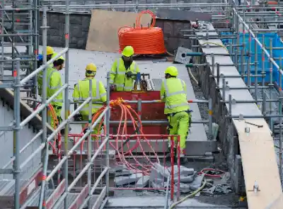 Construction crew working together on site | Charleston Concrete