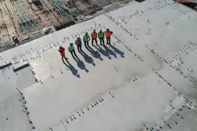 Construction team with seven workers standing | Charleston Concrete