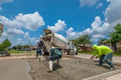 Construction workers laying concrete for driveway | Charleston Concrete