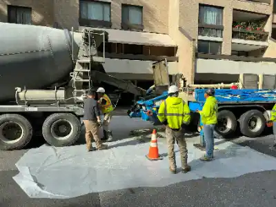 Group of men standing together at concrete worksite | Charleston Concrete