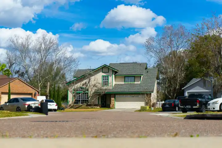 Suburban street lined with houses and parked cars | Charleston Concrete