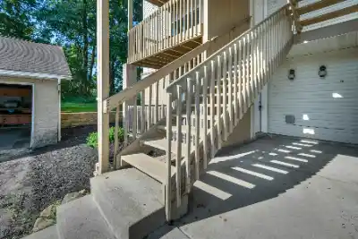 Wooden outdoor staircase providing access above ground level | Charleston Concrete
